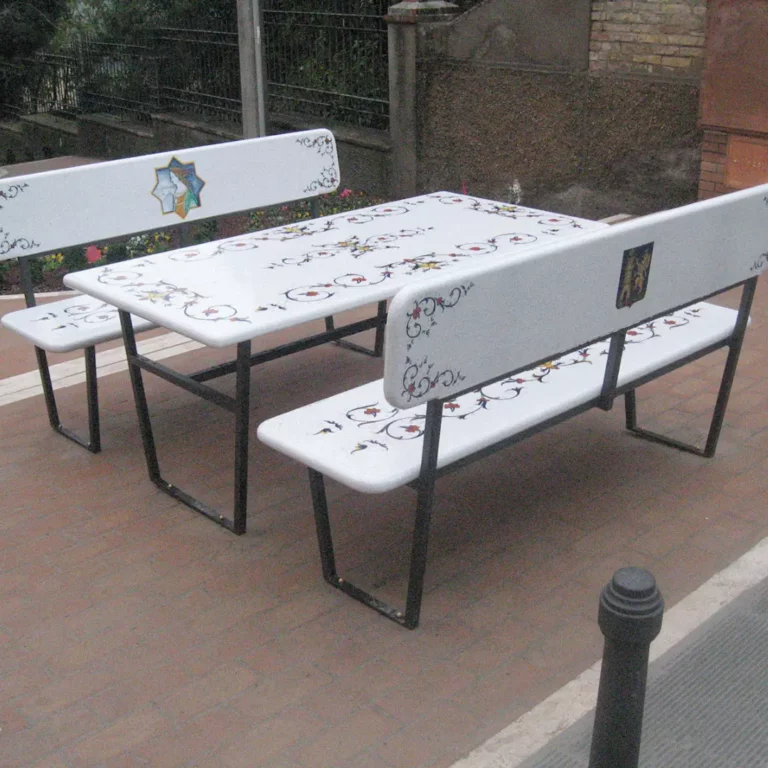 A lava stone set, table, and benches in blooming harmony design. Elevate urban decor with products that can withstand harsh weather conditions.