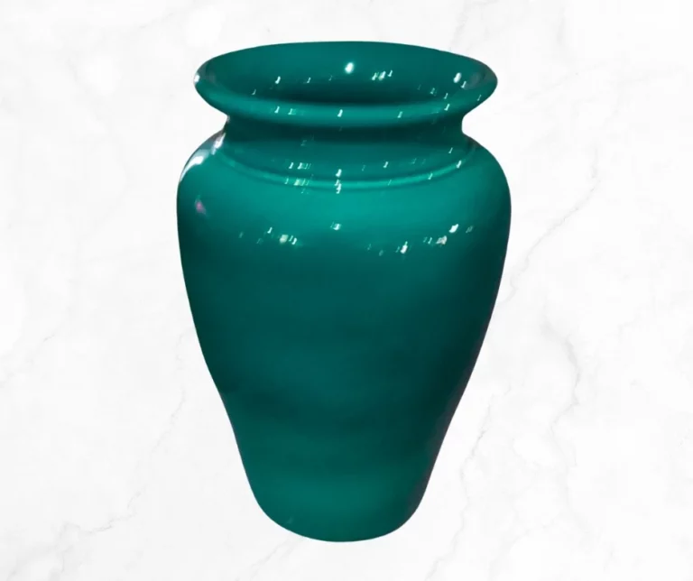 An emerald hue umbrella stand. Ideal for elevating any entry! Add a touch of elegance to your space!