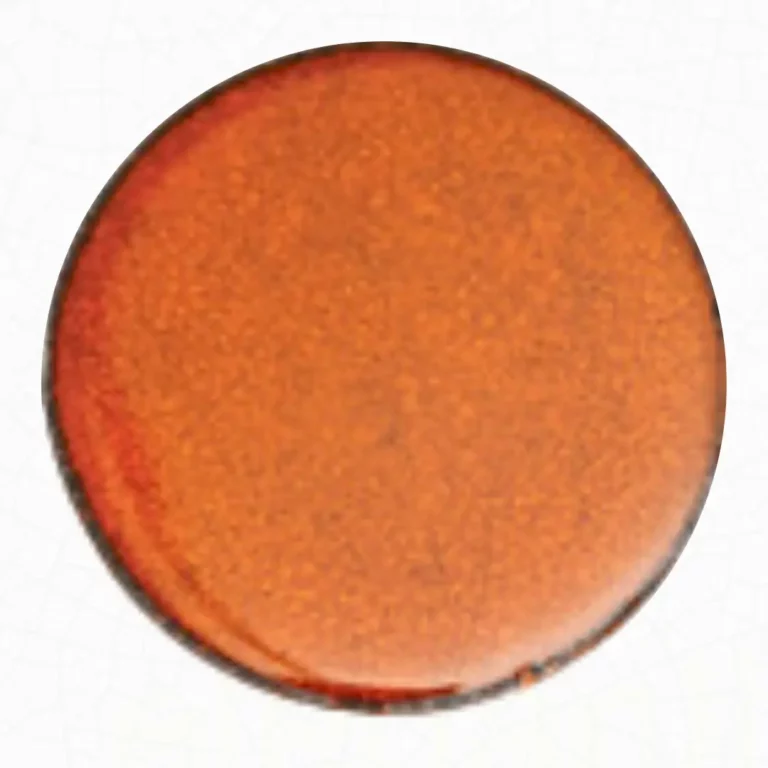 A mono-color lava stone table in orange glow hues.