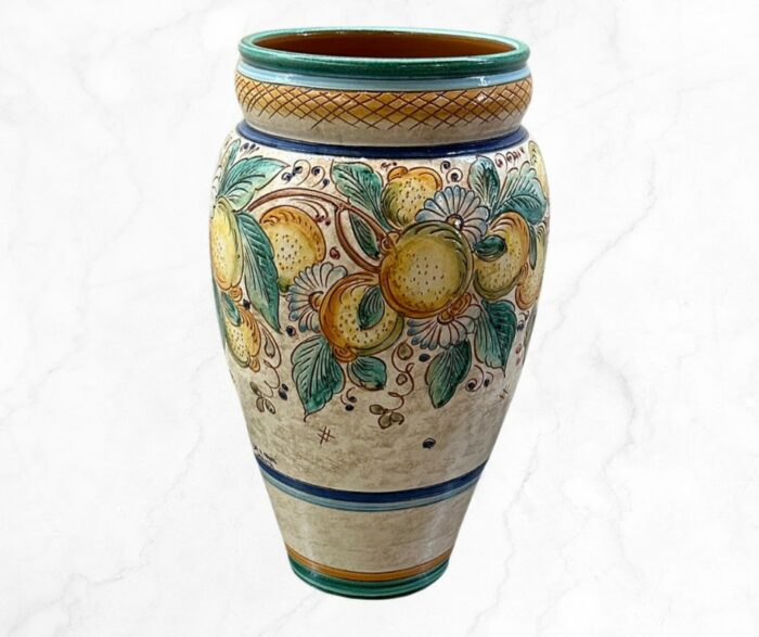 This is a ceramic umbrella stand. Verdeta Bloom Umbrella Stand is the best choice for your entryway.