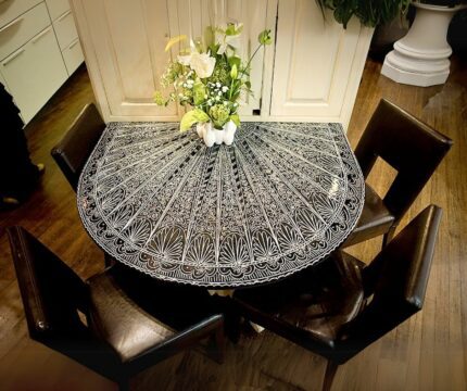This is a Geometric Lava Stone Table. A black background with symmetrical white lines.